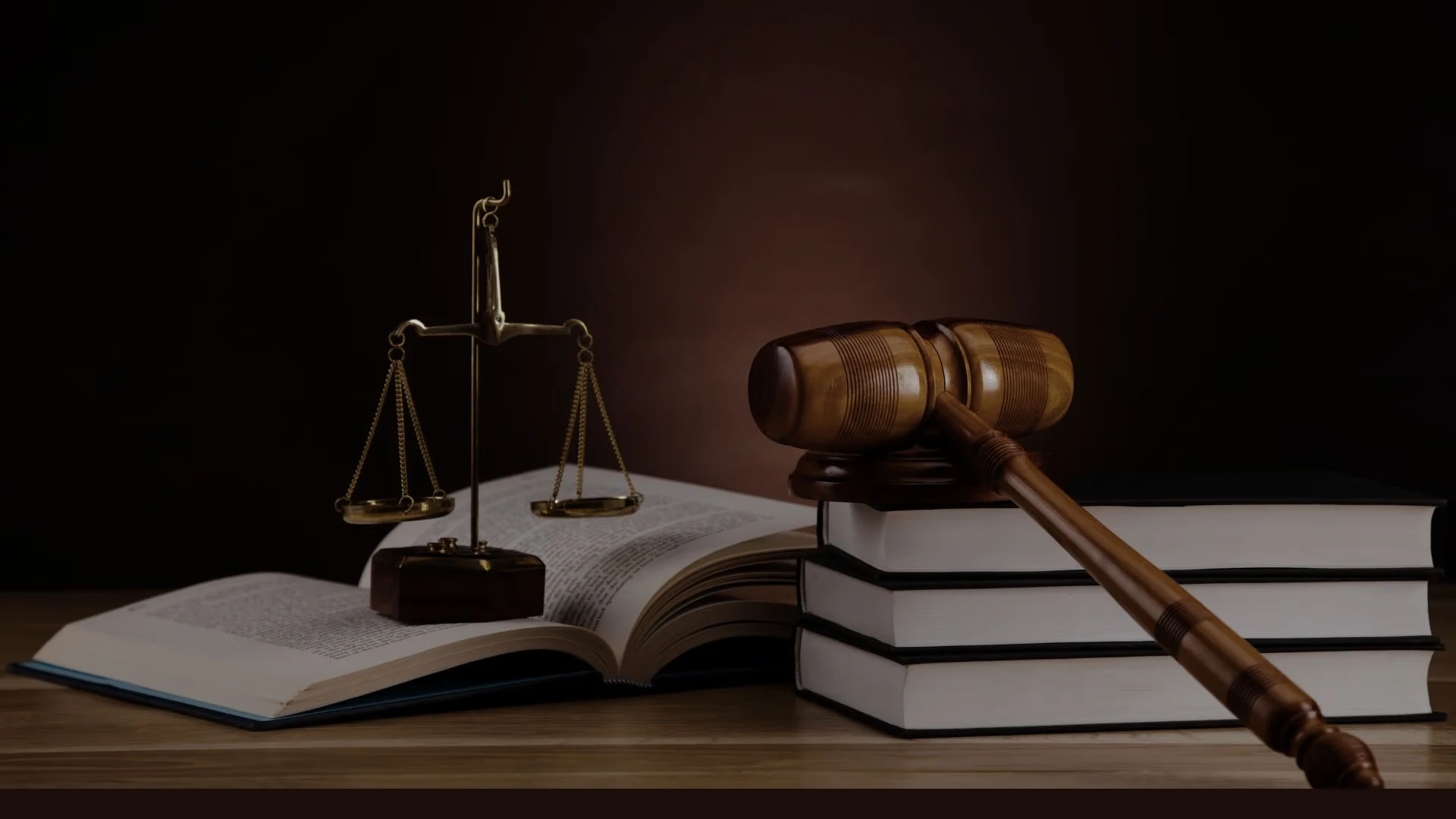 Scales of justice and gavel on a desk in a law office